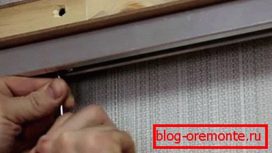Guide monté sur la barre de roulement
